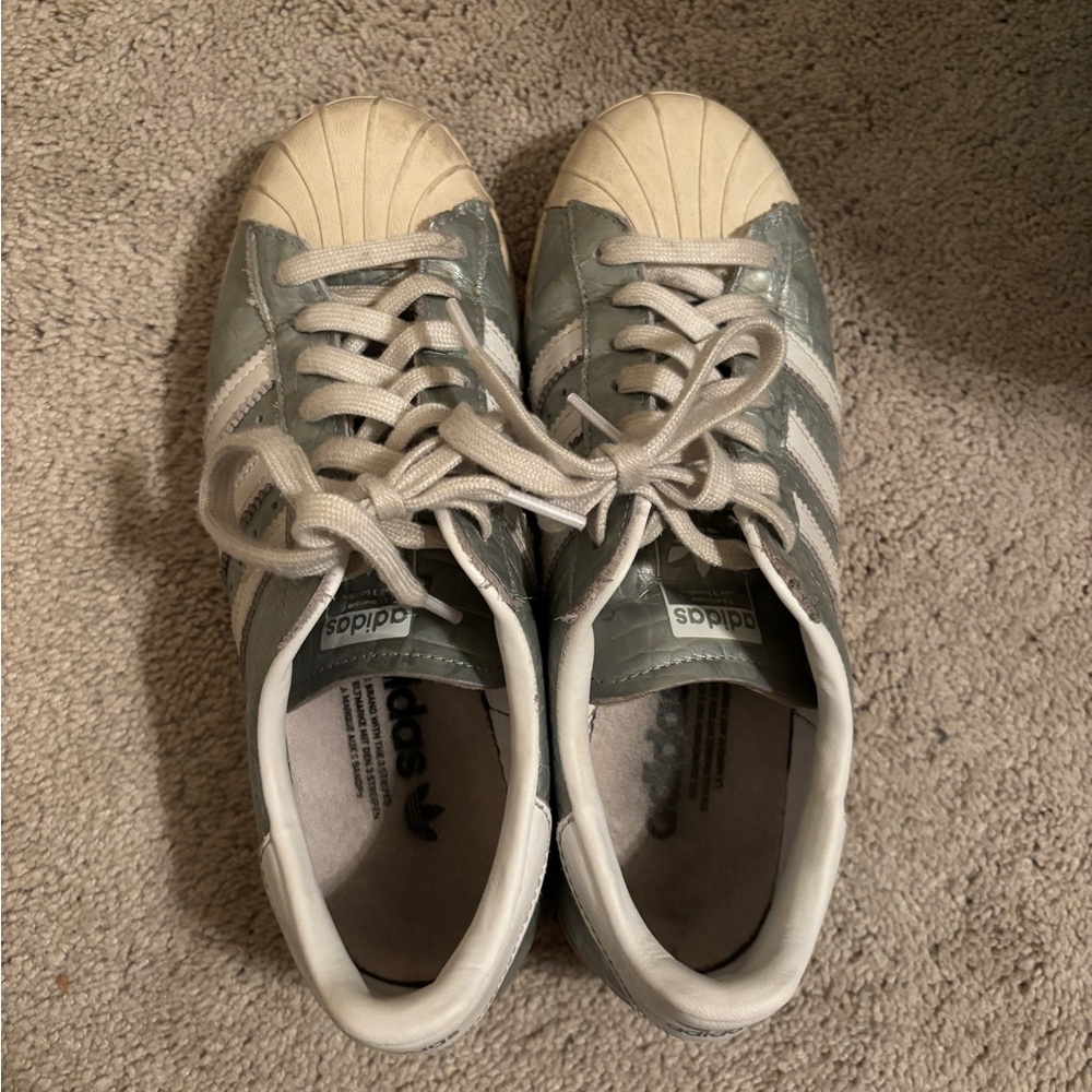 Silver and white adidas sneakers